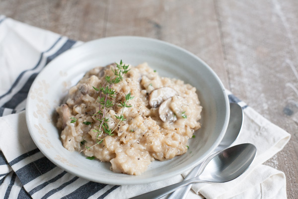 Easy Oven Risotto with Mushrooms | BourbonandHoney.com -- Creamy, cheesy and oh-so comforting, this Easy Oven Risotto with mushrooms is so quick to make that you can even serve it during the week!