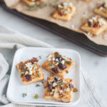 Caramelized Onion and Apple Tarts with Blue Cheese and Cranberries | BourbonandHoney.com -- These super flavorful Caramelized Onion and Apple Tarts with Blue Cheese and Cranberries are the perfect bite sized appetizer!