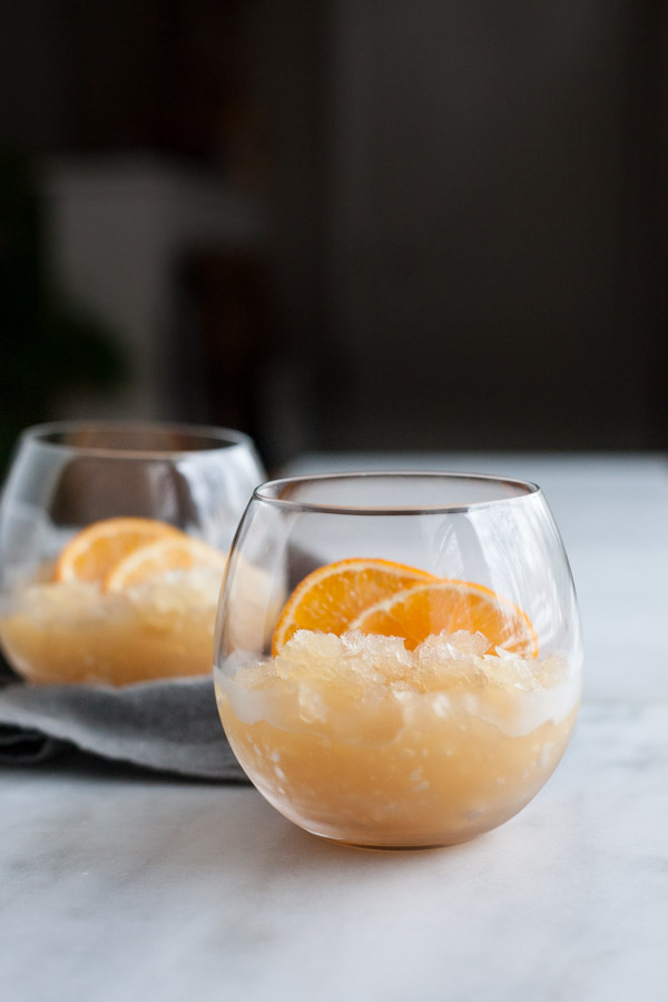 Clementine Bourbon Slush | BourbonandHoney.com -- Sweet, slushy and perfectly boozy this Clementine Bourbon Slush is a just as delicious in the middle of a snow storm as it is in the dog days of summer!