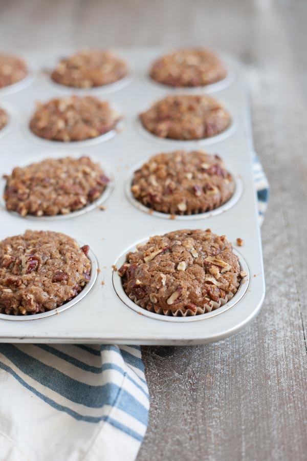 Gingerbread Muffins with Ginger Pecan Crumble | BourbonandHoney.com -- These melt-in-your-mouth Gingerbread Muffins with Ginger Pecan Crumble are seriously flavorful and perfect for breakfast, brunch or a sweet snack!