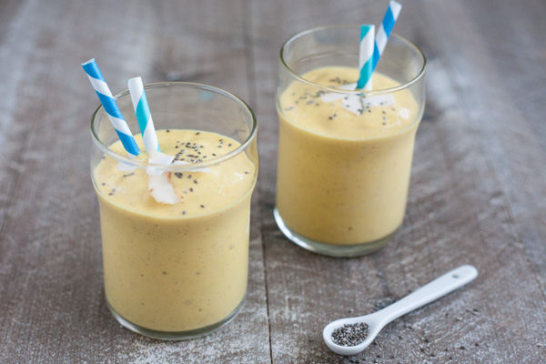 Coconut Mango Turmeric Smoothie | BourbonandHoney.com -- This Coconut Mango Turmeric Smoothie is packed with coconut, mango, banana and turmeric for a fruity snack or super healthy start to your day!