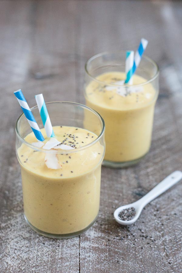 Coconut Mango Turmeric Smoothie | BourbonandHoney.com -- This Coconut Mango Turmeric Smoothie is packed with coconut, mango, banana and turmeric for a fruity snack or super healthy start to your day!