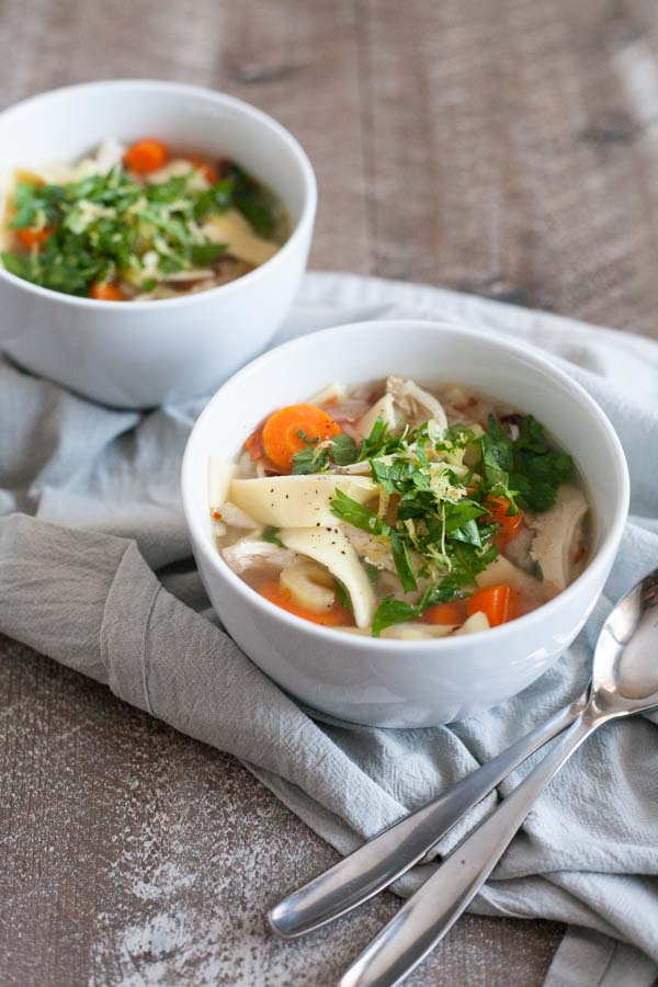 Hearty Slow Cooker Chicken Noodle Soup | BourbonandHoney.com -- Comforting, easy and hearty this Slow Cooker Chicken Noodle Soup is just the thing for when you're feeling crummy or needing to keep warm on a chilly winter day.