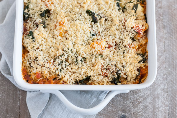 Baked Tortellini from One Pan & Done by Molly Gilbert | BourbonandHoney.com -- Cheesy pasta, kale, tomatoey beans and a crunchy panko topping make this Baked Tortellini a hearty and comforting weeknight dinner that's ready for the oven in just 15 minutes!
