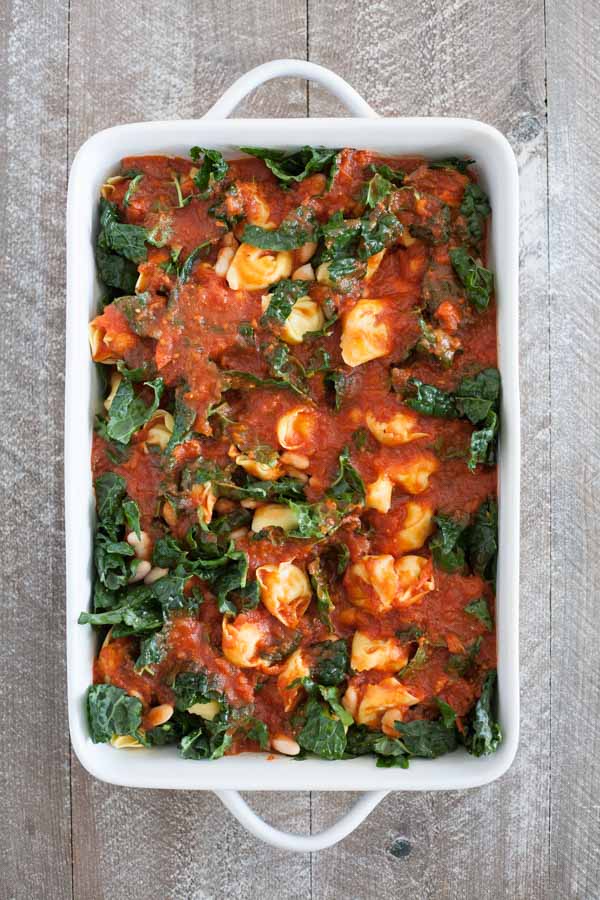 Baked Tortellini from One Pan & Done by Molly Gilbert | BourbonandHoney.com -- Cheesy pasta, kale, tomatoey beans and a crunchy panko topping make this Baked Tortellini a hearty and comforting weeknight dinner that's ready for the oven in just 15 minutes! 