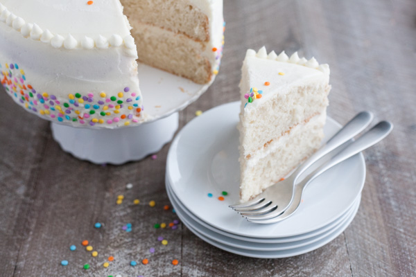 Champagne Cake with Buttercream Frosting | BourbonandHoney.com -- This Champagne Cake with Buttercream Frosting is the perfect cake recipe to celebrate with! It's light, tender, sweet and spiked with champagne!