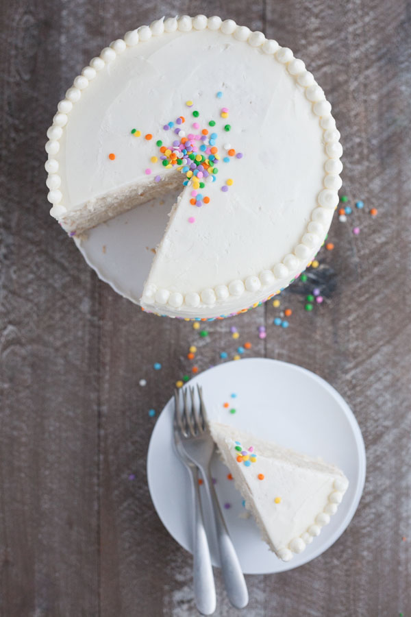 Champagne Cake with Buttercream Frosting | BourbonandHoney.com -- This Champagne Cake with Buttercream Frosting is the perfect cake recipe to celebrate with! It's light, tender, sweet and spiked with champagne!