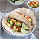 Slow Cooker Jamaican Jerk Chicken Tacos | BourbonandHoney.com -- Spicy, sweet and super flavorful, these Slow Cooker Jamaican Jerk Chicken Tacos are an easy make ahead dinner that can serve a crowd!