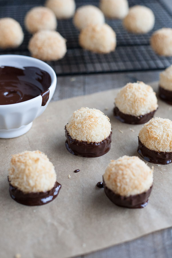 Easy Chocolate Dipped Coconut Macaroons | BourbonandHoney.com -- With double the coconut, these dark chocolate dipped coconut macaroons have a deliciously chewy inside and crispy outside for the perfect sweet treat!
