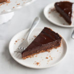 Bourbon and Honey Chocolate Tart | BourbonandHoney.com -- With a splash of bourbon, a drizzle of honey and a pretzel-graham cracker crust, this indulge chocolate tart is the perfect recipe for any chocolate lover!