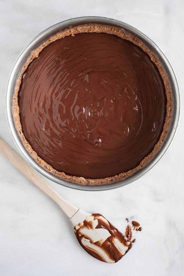 Bourbon and Honey Chocolate Tart | BourbonandHoney.com -- With a splash of bourbon, a drizzle of honey and a pretzel-graham cracker crust, this indulge chocolate tart is the perfect recipe for any chocolate lover!