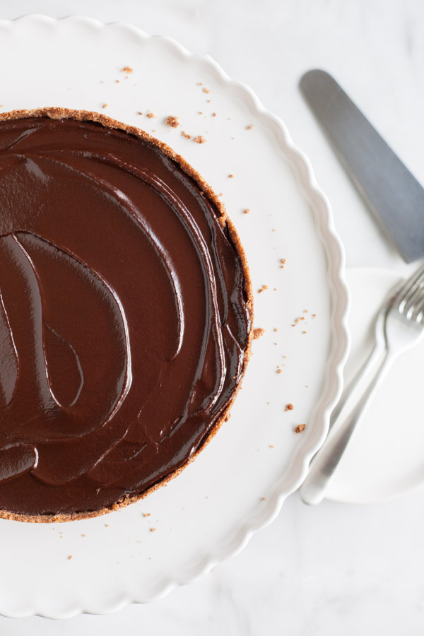 Bourbon and Honey Chocolate Tart | BourbonandHoney.com -- With a splash of bourbon, a drizzle of honey and a pretzel-graham cracker crust, this indulge chocolate tart is the perfect recipe for any chocolate lover!
