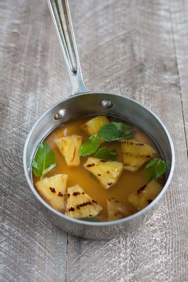 Bourbon and Honey Grilled Pineapple Mint Julep | BourbonandHoney.com -- This Pineapple Mint Julep is a tropical and refreshing twist on a traditional cocktail! It's the perfect, slightly sweet and ultra boozy derby day drink!