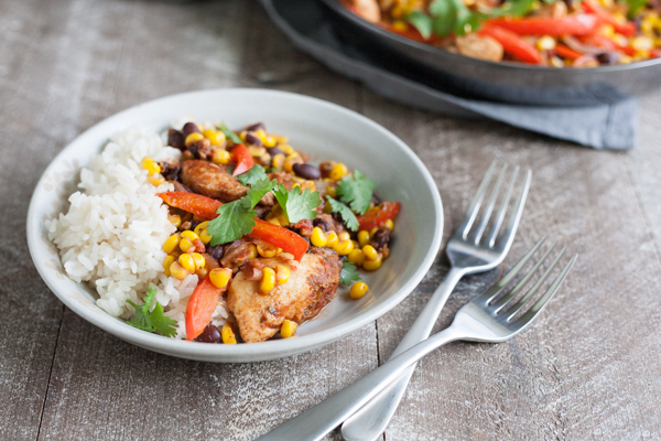 Easy Skillet Chicken with Black Beans and Corn | BourbonandHoney.com -- Spicy, delicious and on the table in 20 minutes, this Easy Skillet Chicken recipe is a serious weeknight winner and a quick family favorite!
