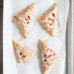 Easy Strawberry Rhubarb Turnovers | BourbonandHoney.com -- Sweet, tarty and perfectly flaky these Strawberry Rhubarb Turnovers are a deliciously easy spring treat or brunch recipe!