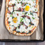 Bacon and Egg Burrata Breakfast Pizza | BourbonandHoney.com -- Start your morning right with this Bacon and Egg Burrata Breakfast Pizza recipe. It's cheesy, bacon-y and top with perfectly cooked eggs.