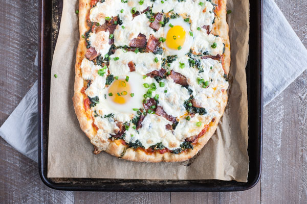 Bacon and Egg Burrata Breakfast Pizza | BourbonandHoney.com -- Start your morning right with this Bacon and Egg Burrata Breakfast Pizza recipe. It's cheesy, bacon-y and top with perfectly cooked eggs.