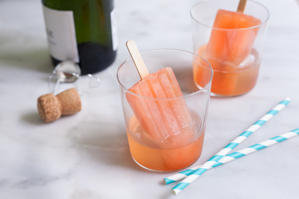 Boozy Aperol Spritz Popsicles | BourbonandHoney.com -- These slightly boozy Aperol Spritz Popsicles are the perfect recipe to cool down during the heat of summer, especially when served with a splash of Prosecco!