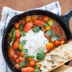 Grilled Tomatoes with Burrata and Basil | BourbonandHoney.com -- This summery skillet recipe of Grilled Tomatoes with Burrata and Basil is a great appetizer, light lunch or dinner served over pasta!