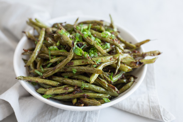 Spicy Szechuan Green Beans | BourbonandHoney.com -- Quick, spicy and totally delicious, these Szechuan Green Beans are the perfect side dish for a dinner party or a weeknight dish.