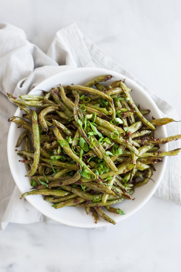 Spicy Szechuan Green Beans | BourbonandHoney.com -- Quick, spicy and totally delicious, these Szechuan Green Beans are the perfect side dish for a dinner party or a weeknight dish.