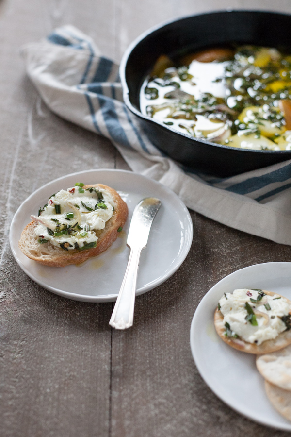 Baked Goat Cheese with Garlic and Herbs | BourbonandHoney.com -- This Baked Goat Cheese with Garlic and Herbs recipe is a quick and flavorful appetizer for a crowd. Besides being super easy, you can also make it ahead of time so you can really enjoy the party!
