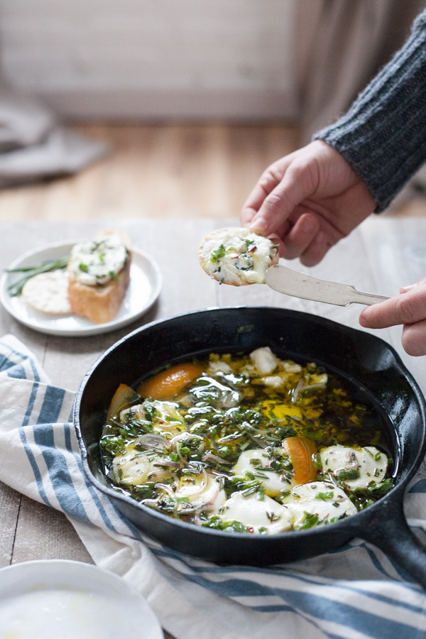 Baked Goat Cheese with Garlic and Herbs | BourbonandHoney.com -- This Baked Goat Cheese with Garlic and Herbs recipe is a quick and flavorful appetizer for a crowd. Besides being super easy, you can also make it ahead of time so you can really enjoy the party!